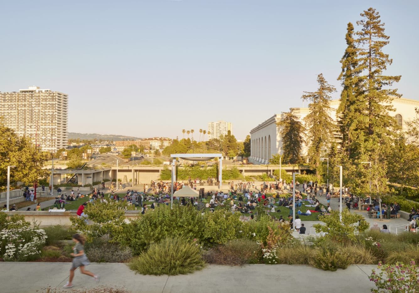 Oakland Museum of California: The renovation of the gardens at the Oakland Museum of California serves as a remarkable illustration of how public spaces can be redesigned to become more inclusive, functional, and representative of the local culture. This renovation project achieved several goals, including promoting interaction within the city, reflecting the essence of the local culture, preserving historical elements, providing multifunctionality, creating communal spaces, and ensuring operational efficiency. Photo Credit: Caitlin Atkinson